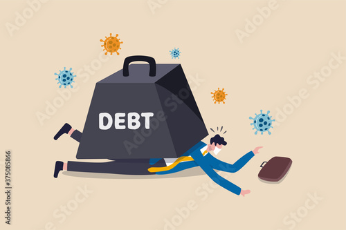 Coronavirus economic crash causing big debt on business and unemployment concept, poor depressed and jobless businessman wearing face mask cannot move lay down under huge weight of debt with virus.