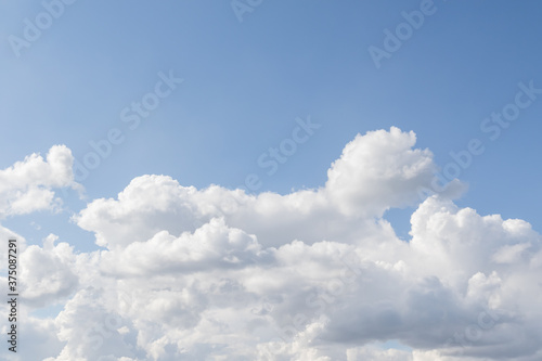Blue sky with large white clouds, sky background.