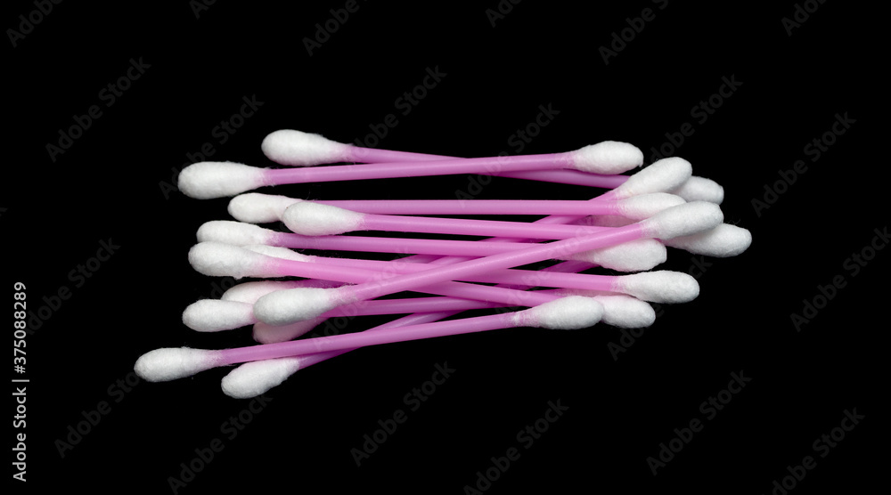 Hygienic cotton swabs on a black background. Hygienic cotton swabs on a black background.