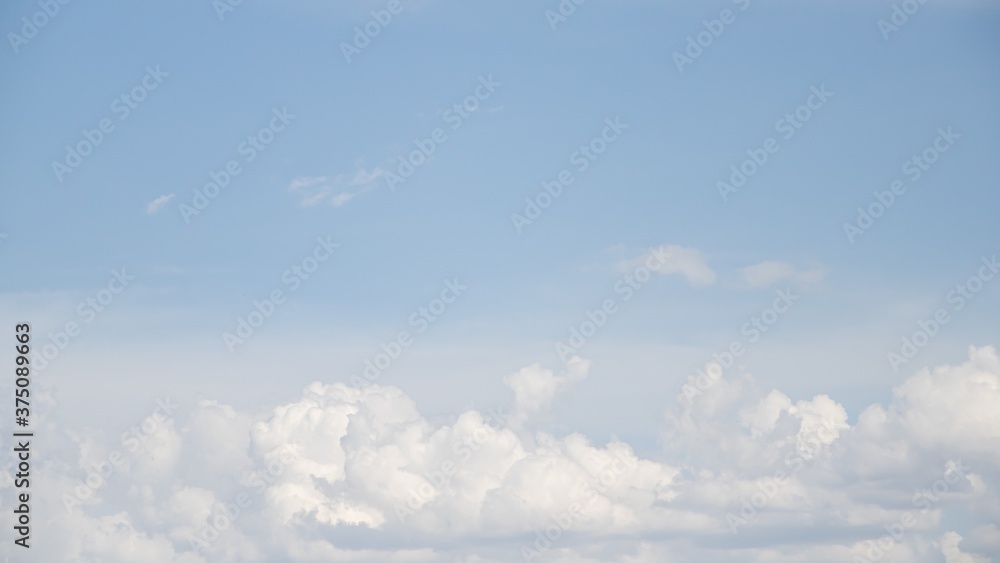 White cumulus clouds against the blue sky. White cumulus clouds against the blue sky.
