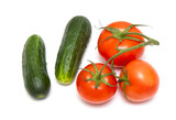 Red tomato and green cucumber isolated on a white background.