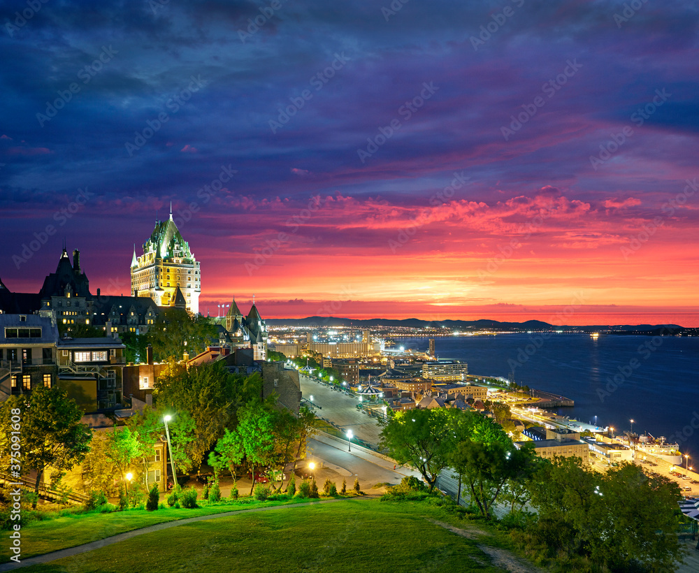 Aerial view of the Quebec City skyline with the iconic Chateau Frontenac illuminated in foreground
