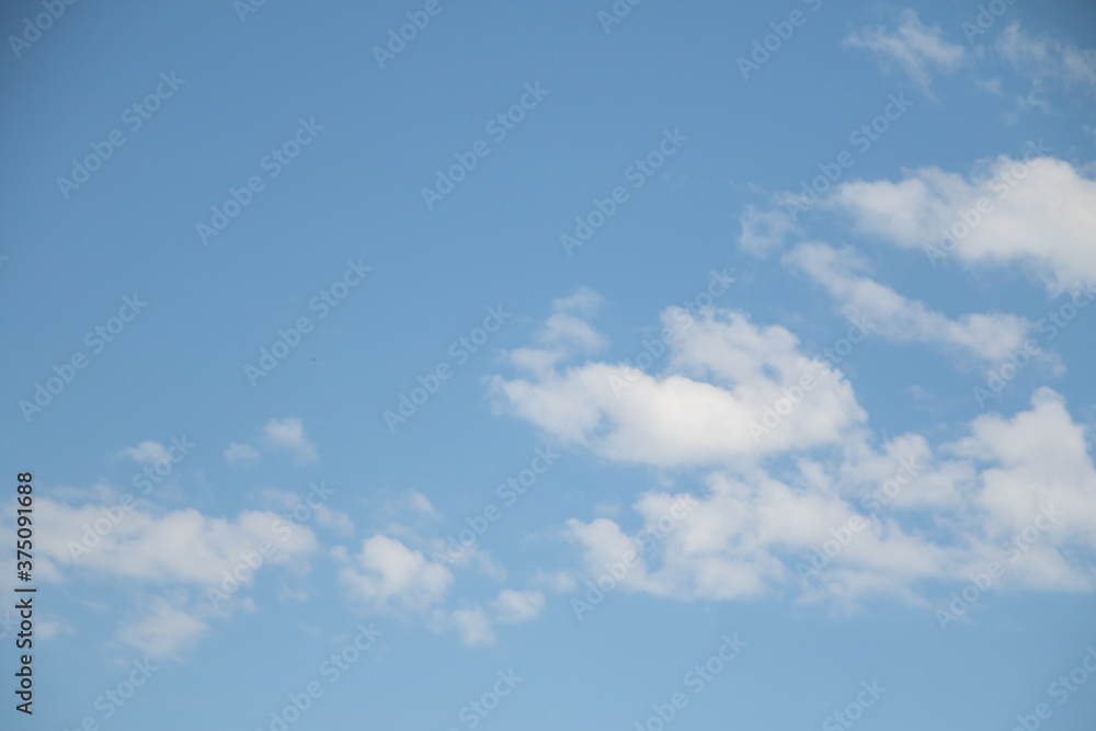 Blue Sunny sky, white Cumulus clouds lower layer of cloud cover, sky background . Blue Sunny sky, white Cumulus clouds lower layer of cloud cover, sky background .