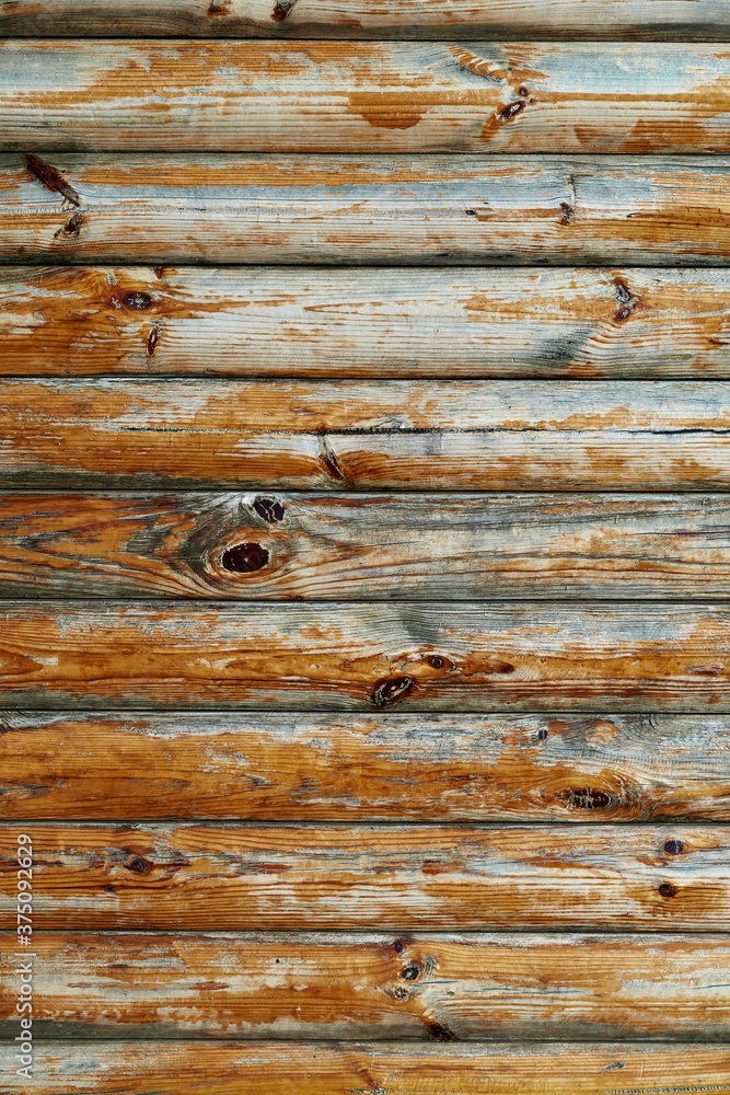 Fototapeta premium old weathered wooden planks as a brown background, peeling paint and cracks