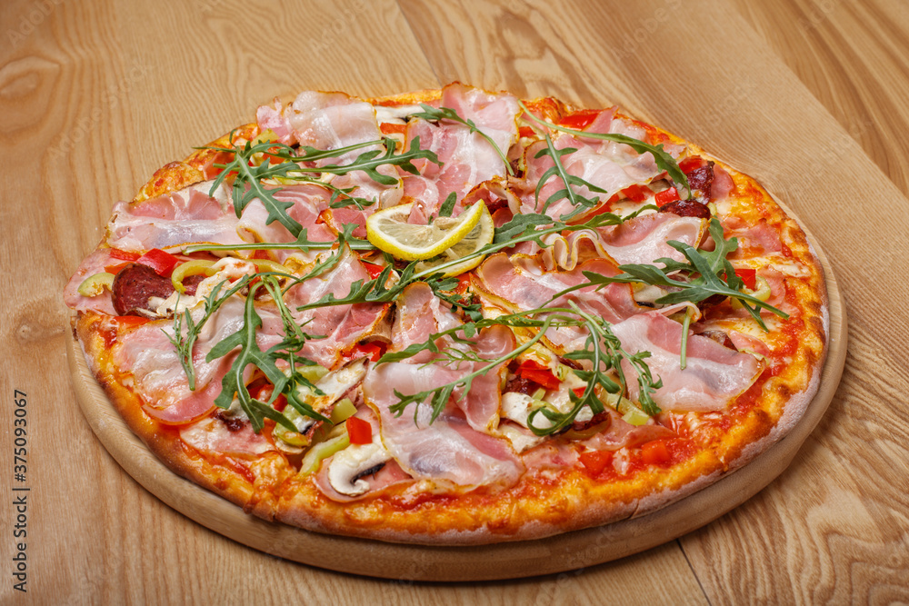 pizza with salami and arugula