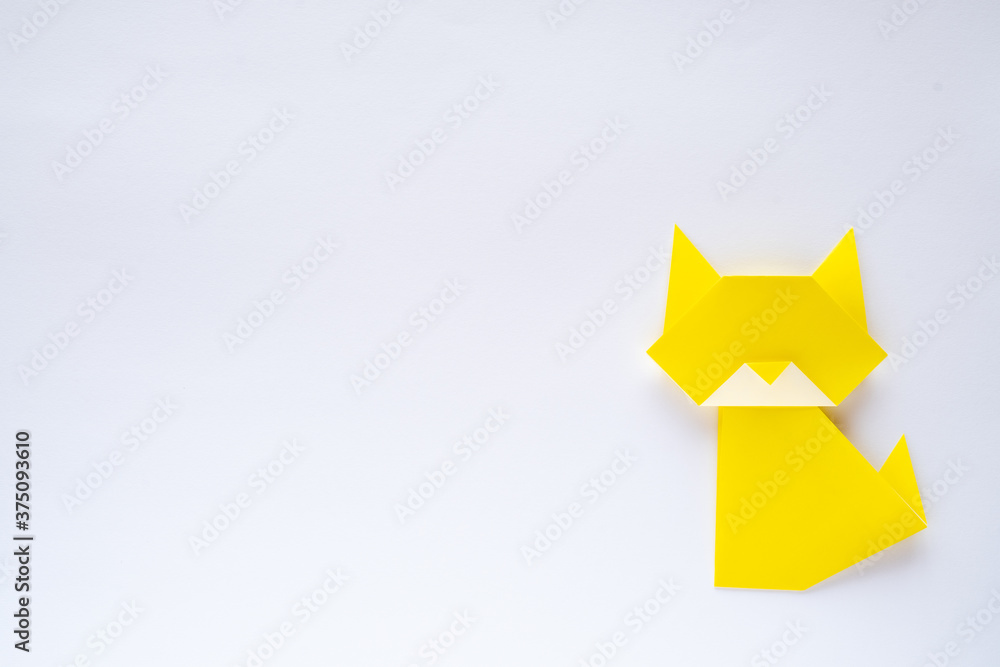 yellow origami cat on white background yellow origami cat on white background