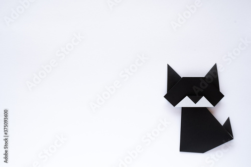 black origami cat on white background