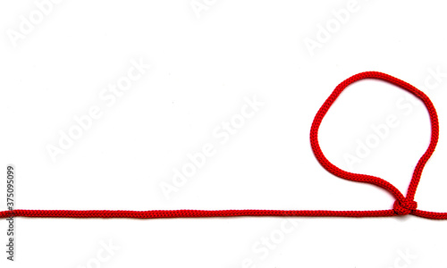 Red twine with knots on a white background.