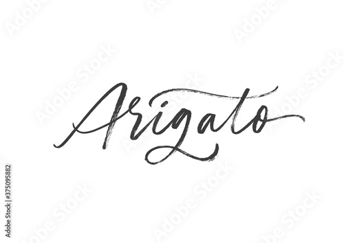 Arigato ink brush vector lettering. Thank you in Japanese. Modern phrase handwritten vector calligraphy. Black paint lettering isolated on white background. Postcard, greeting card, t shirt print.  photo