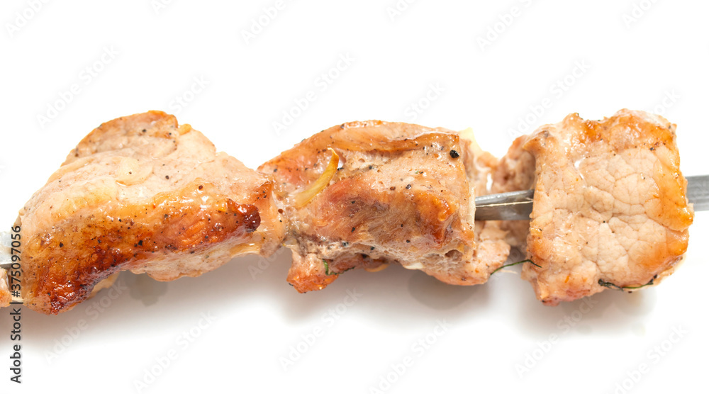 Pieces of fried kebab meat isolated on white background. Pieces of fried kebab meat isolated on white background.
