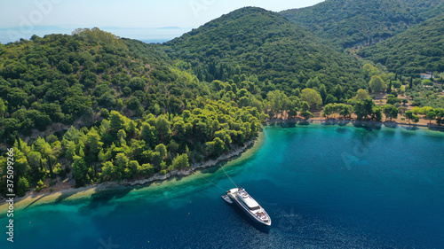 Aerial drone photo of beautiful paradise beach of Skinos covered in pine trees in beautiful Ionian island of Ithaki or Ithaca, Greece