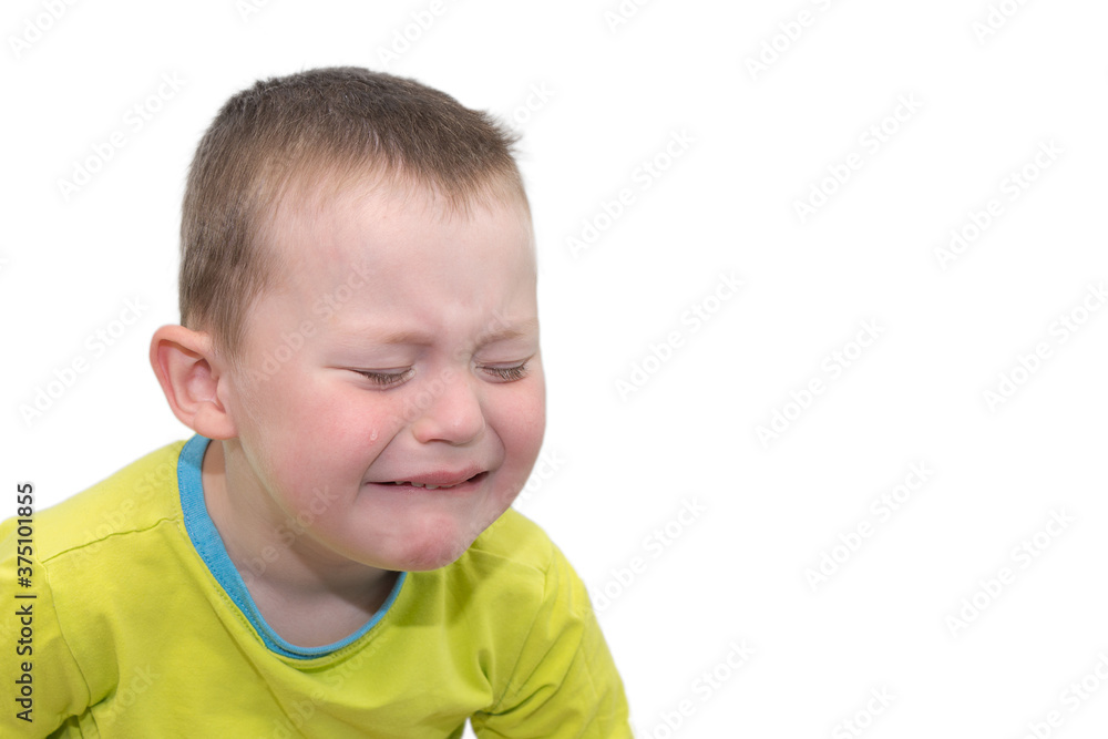 little boy in a bright yellow T-shirt on a white background, is isolated, crying, tears from his eyes. Horizontal photo, close-up. The concept is a big childish grief. little boy in a bright yellow T-shirt on a white background, is isolated, crying, tears from his eyes. Horizontal photo, close-up. The concept is a big childish grief.