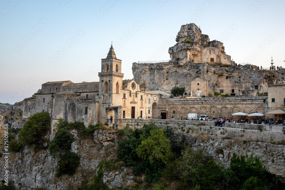  View at Church of San Pietro caveoso and on the top of the hill of Church of Saint Mary of Idris in Matera, Basilicata, Italy