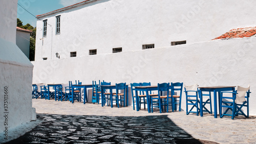 Wooden blue tables at a Greek island