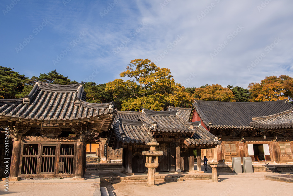 The beautiful and colorful autumn landscape of temple background autumn colored mountain and blue sky. The beautiful and colorful autumn landscape of temple background autumn colored mountain and blue sky.
