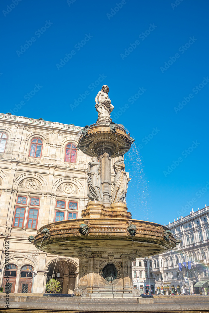 Statues of beautiful women as musicians and singers of State Opera fountain in Vienna, Austria, details, closeup