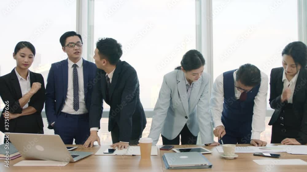 team of asian businesspeople meeting in company conference room discussing business plan team of asian businesspeople meeting in company conference room discussing business plan