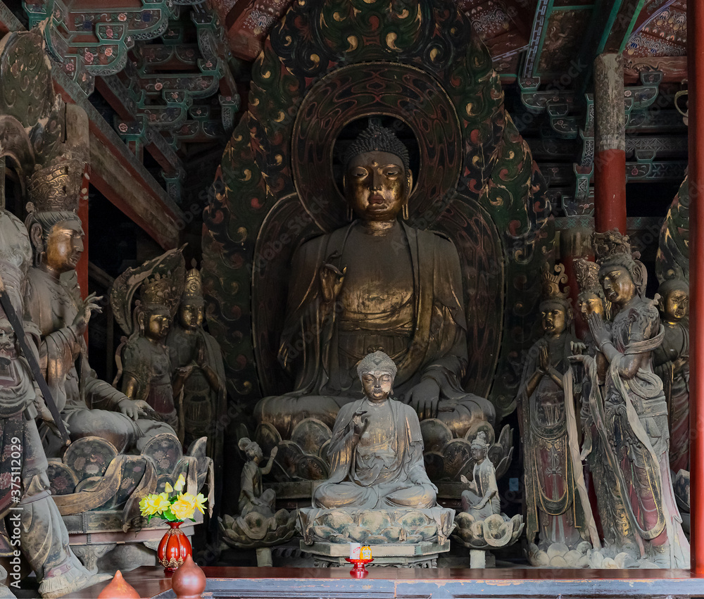 Historic sculpture of Buddha and Bodhisattvas in Mahavira or Great Hall at Upper Huayan Monastery, a Buddhist temple built from Liao dynasty in 11th century, Datong, Shanxi, China. Heritage.