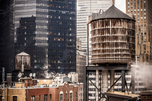 Wooden water tank In a New York city rooftop