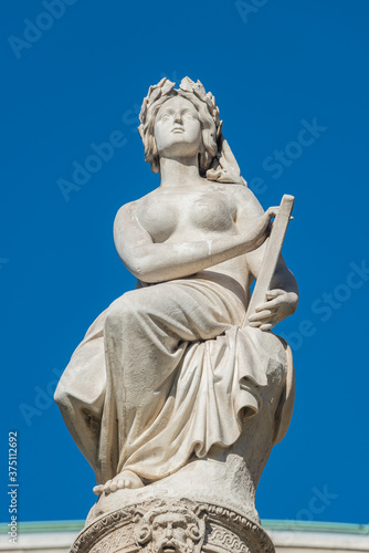Statues of beautiful women as musicians and singers of State Opera fountain in Vienna  Austria  details  closeup