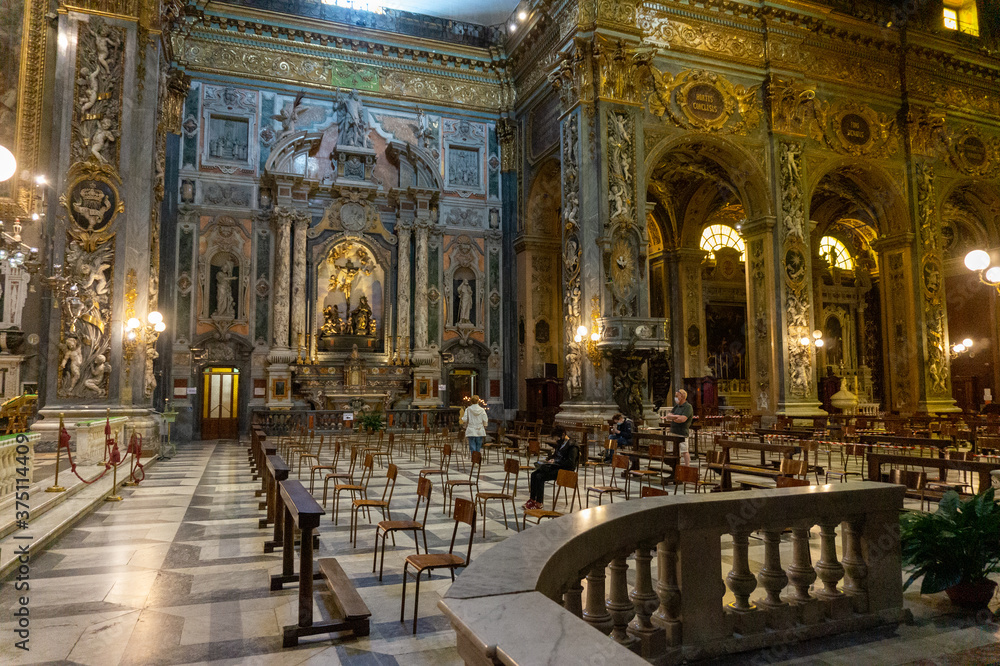 Chiavari, Italy -  June, 28 2020: Interior of the Cathedral Basilica of Our Lady of the Garden with quota measures during the coronavirus pandemic