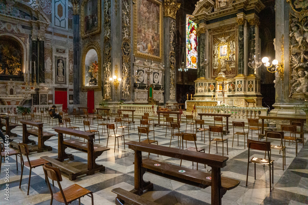Chiavari, Italy -  June, 28 2020: Interior of the Cathedral Basilica of Our Lady of the Garden with quota measures during the coronavirus pandemic