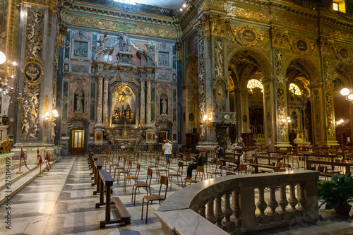 Chiavari, Italy - June, 28 2020: Interior of the Cathedral Basilica of Our Lady of the Garden with quota measures during the coronavirus pandemic