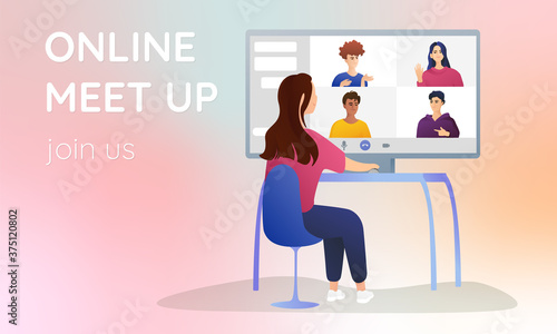A young girl sits at a computer and communicates with colleagues. Online call, video conference. Bright guys on the screen, online communication concept.