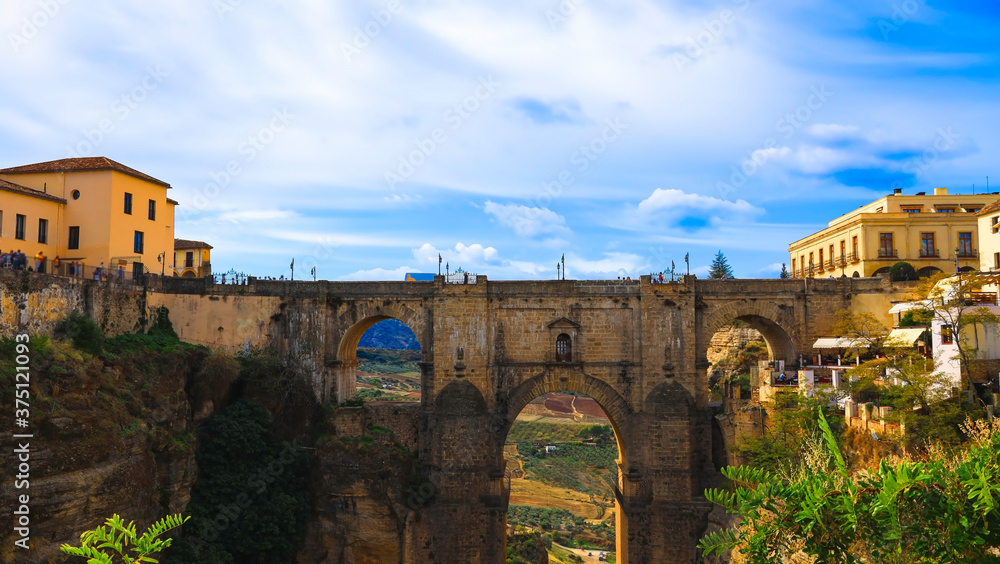 Beautiful view of landmark which the famous bridge Puente Nuevo in the historic city centre,Ronda,Spain Beautiful view of landmark which the famous bridge Puente Nuevo in the historic city centre,Ronda,Spain