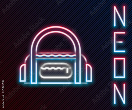 Glowing neon line Sport bag icon isolated on black background. Colorful outline concept. Vector Illustration.