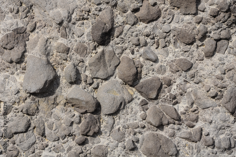 Grey volcanic rocks texture with basalt, geological formation Grey volcanic rocks texture with basalt, geological formation