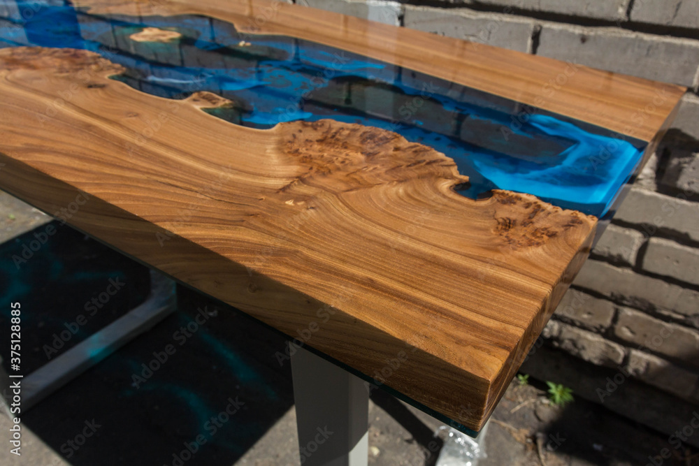 beautiful wooden table made of elm slab and epoxy resin - obrazy, fototapety, plakaty 