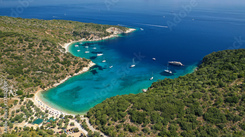 Aerial drone photo of turquoise heart shaped paradise sandy beach and bay of Sarakiniko a safe sail boat anchorage in Ithaki or Ithaca island, Ionian, Greece photo