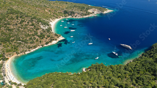 Aerial drone photo of turquoise heart shaped paradise sandy beach and bay of Sarakiniko a safe sail boat anchorage in Ithaki or Ithaca island, Ionian, Greece