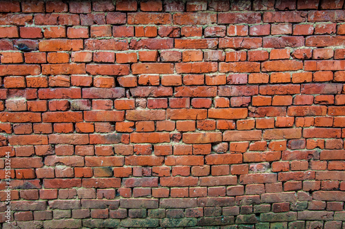 Large brick orange wall of a building. 