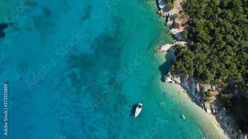 Aerial drone photo of turquoise paradise sandy beach and bay of Filatro a safe sail boat anchorage in Ithaki or Ithaca island, Ionian, Greece