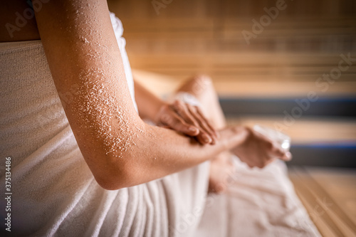 Scrub skin treatment while relax in spa photo