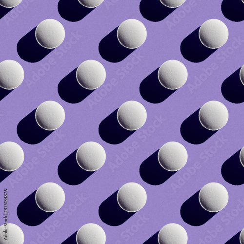 Pill pattern on purple background
