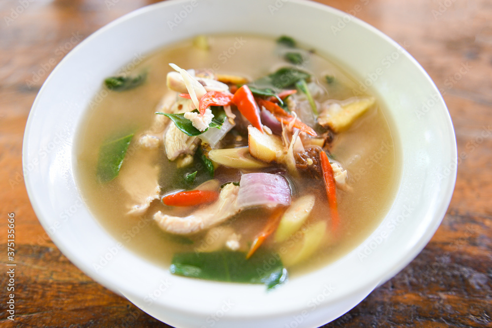 Chicken Tom Yum Spicy Thai food on white bowl - Spicy Chicken Soup Chicken Tom Yum Spicy Thai food on white bowl - Spicy Chicken Soup