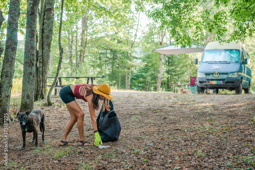 Woman picking up trash