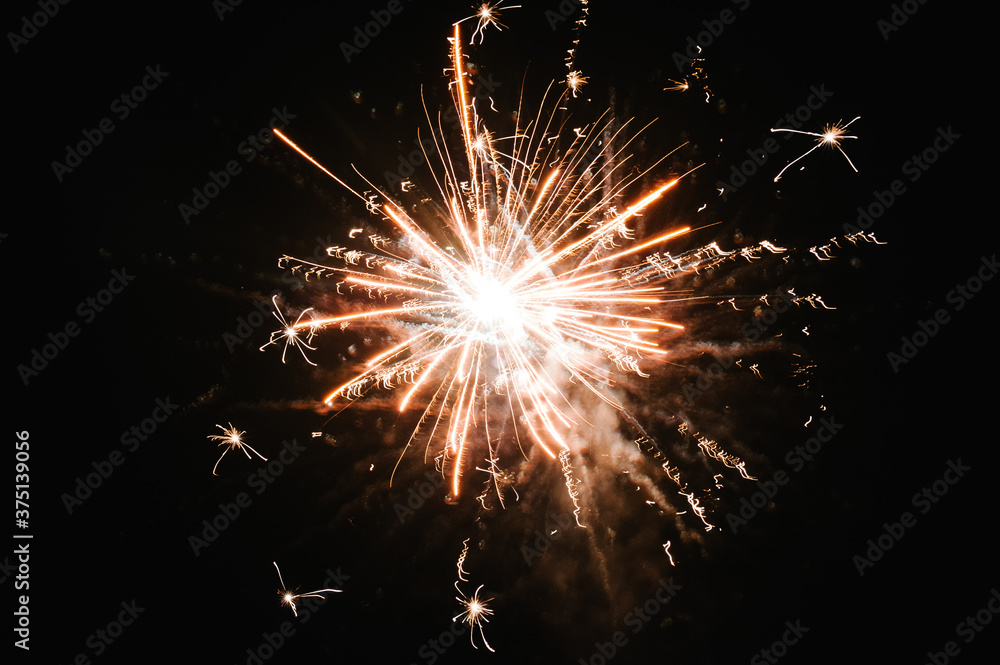 Fireworks in Happy New Year 2021. Holiday festival celebration. Fireworks display on dark sky background.