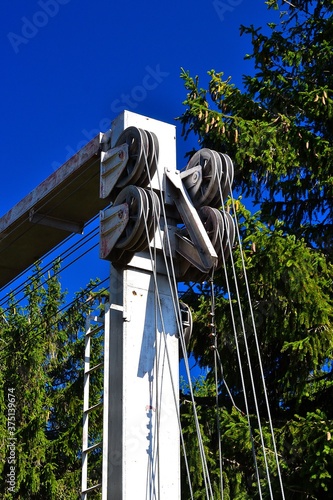 photo of the technical solution of the ski lift, the column with the set of tensioning pulleys during the summer shutdown and maintenance photo