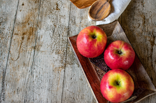 Apple background with copy space on wooden table photo