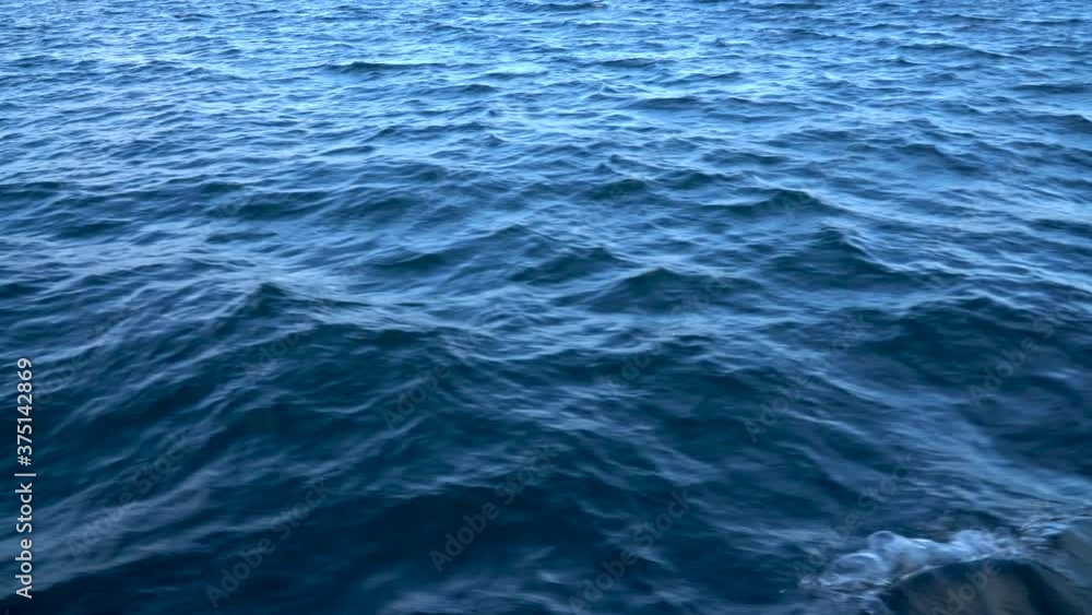 strong storm on the lake, waves beating on the shore. Lake Baikal is the largest freshwater lake in the world. strong storm on the lake, waves beating on the shore. Lake Baikal is the largest freshwater lake in the world.