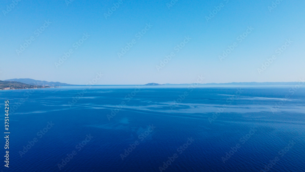 Open blue sea under blue sky.Aerial view 