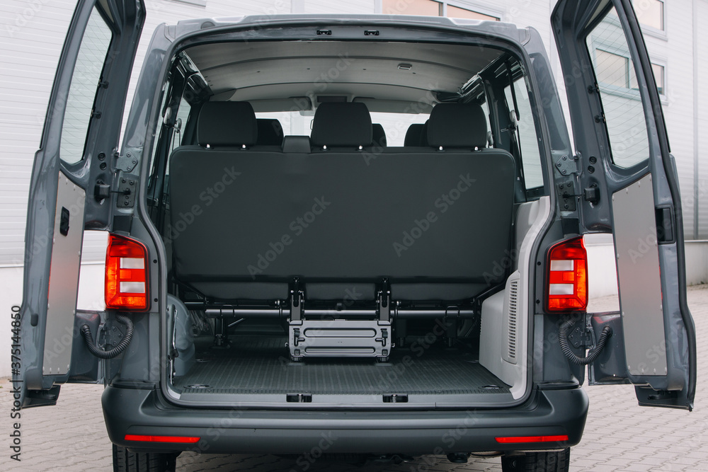 Modern cargo van open trunk. Car boot is open Modern cargo van open trunk. Car boot is open
