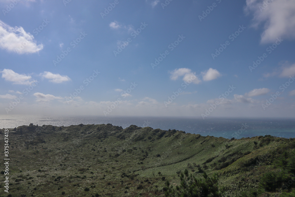 A view of the sea from the mountains of Jeju Island, South Korea A view of the sea from the mountains of Jeju Island, South Korea