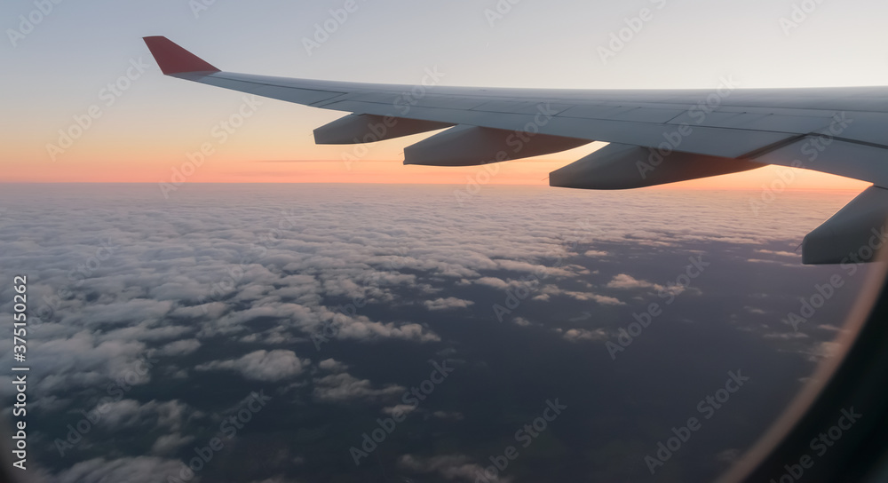Wing of a airplane at sunrise at an altitude of 11 km. Wing of a airplane at sunrise at an altitude of 11 km.