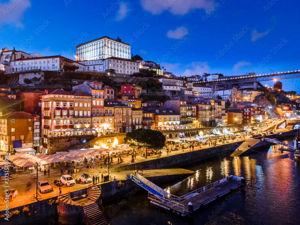 Naklejka premium Historic architecture by Douro river in Porto, Portugal