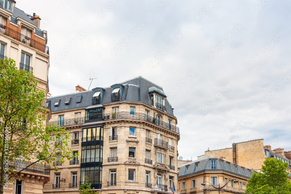 Antique building view in Paris city, France.